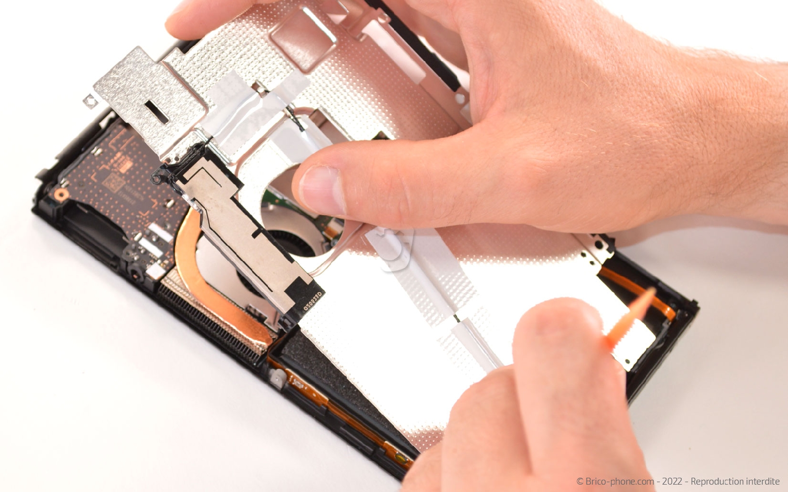 Comment changer le module du lecteur de cartouche sur Switch Oled photo 1